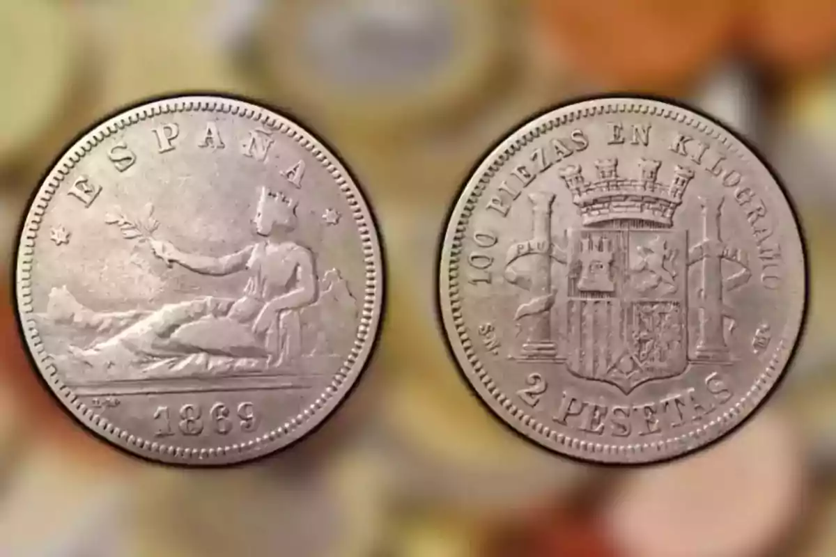 Monedas antiguas de España de 2 pesetas de 1869 con diseño de una figura femenina y escudo. Monedas antiguas de España de 2 pesetas de 1869 con diseño de una figura femenina y escudo.