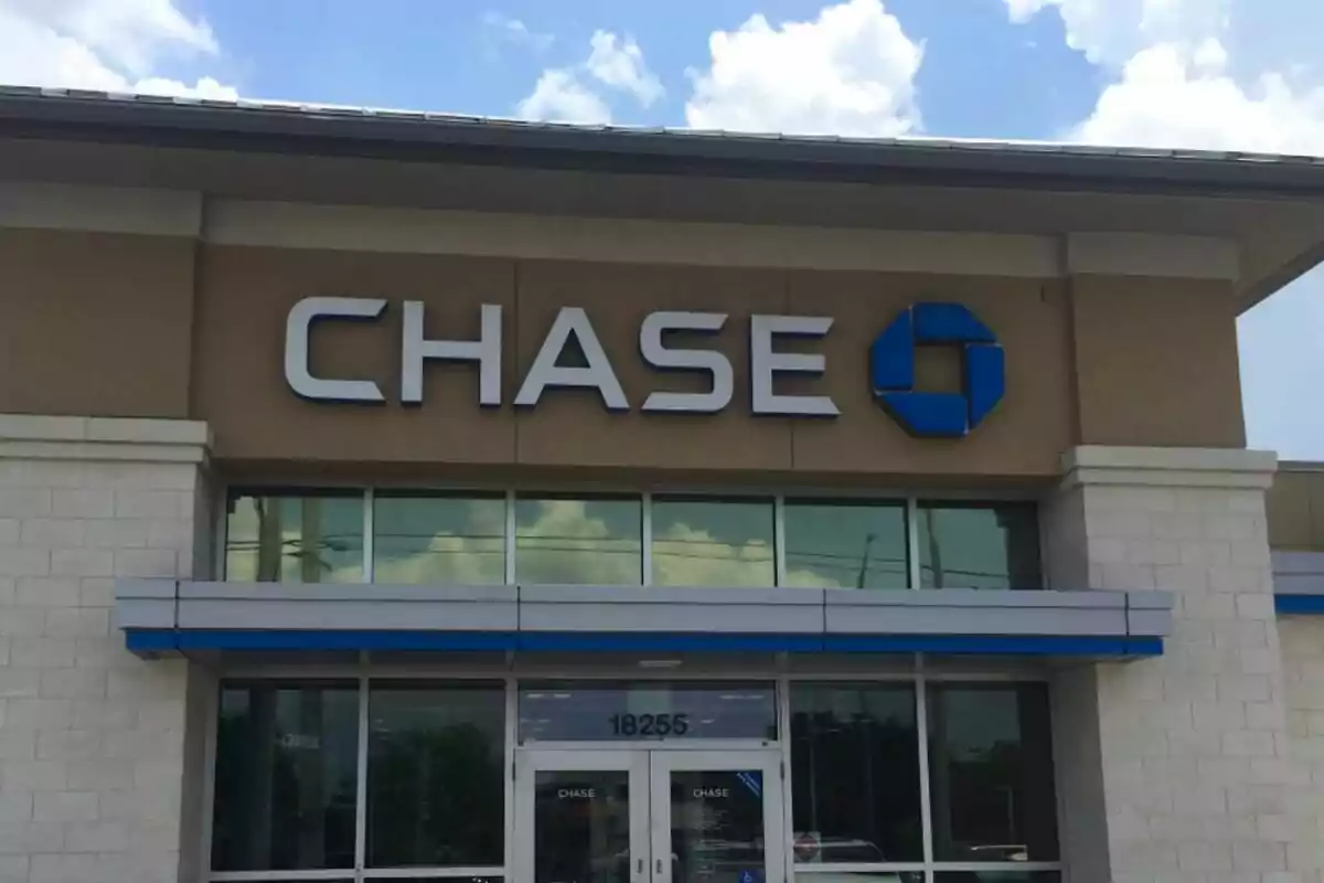 Chase bank branch with the blue logo on the building’s facade. Chase bank branch with the blue logo on the building’s facade.
