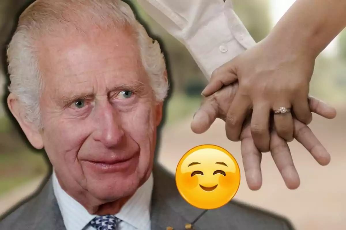 Charles III looks at some intertwined hands with an engagement ring and a smiling emoji in front.