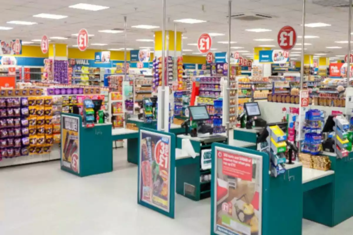 Supermarket with cash registers and shelves full of products with signs indicating low prices Supermarket with cash registers and shelves full of products with signs indicating low prices
