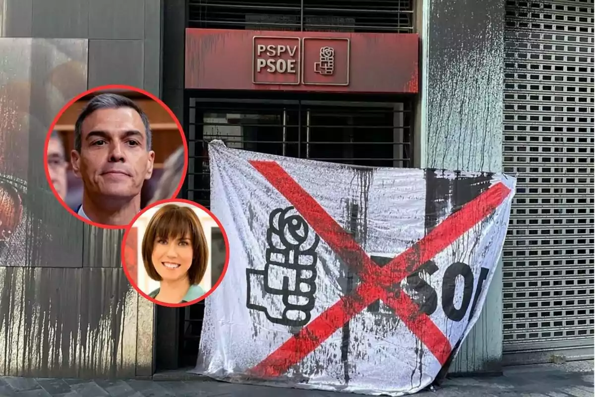 Fachada de una sede del PSOE con una pancarta en la entrada que tiene una gran cruz roja y manchas negras, junto a dos retratos circulares de un hombre y una mujer