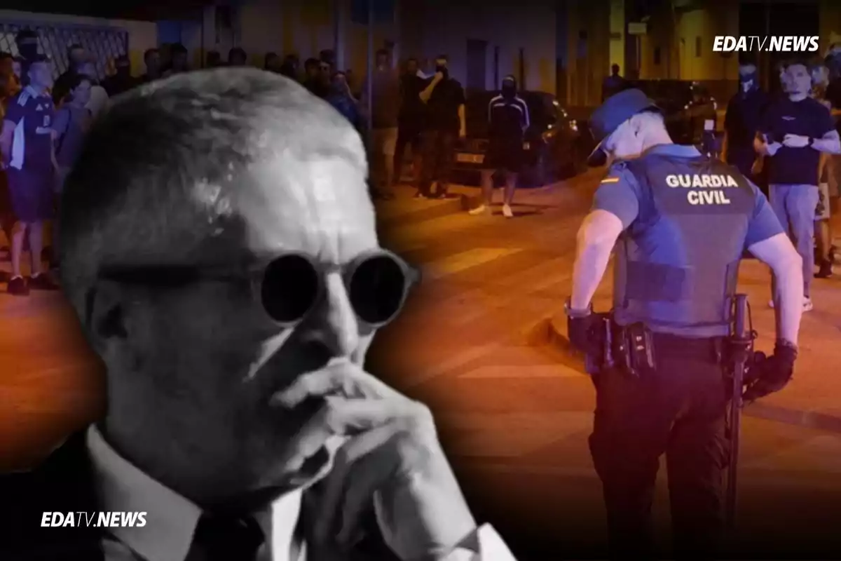 Un hombre con gafas oscuras en primer plano y al fondo un agente de la Guardia Civil rodeado de personas en una calle de noche