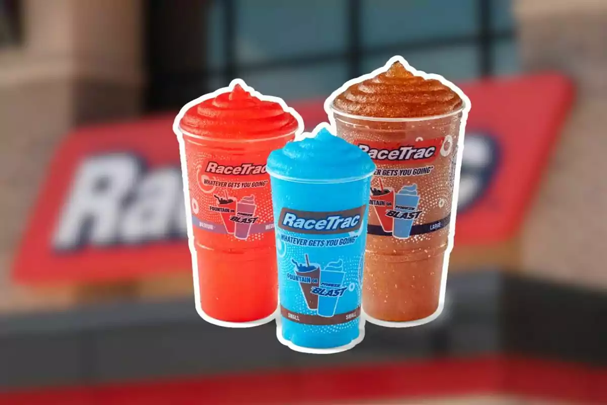 Three slushy drinks of different flavors and colors in RaceTrac cups in front of a blurry store sign Three slushy drinks of different flavors and colors in RaceTrac cups in front of a blurry store sign