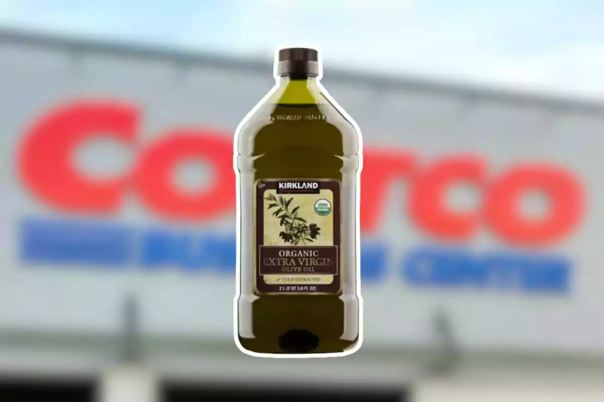 Kirkland brand organic extra virgin olive oil bottle in front of a blurry Costco sign Kirkland brand organic extra virgin olive oil bottle in front of a blurry Costco sign