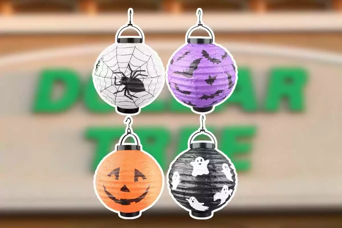 Four paper lanterns with Halloween designs—one white with a spiderweb and spider, one purple with bats, one orange with a jack-o’-lantern face, and one black with ghosts—against a blurred background of a store.