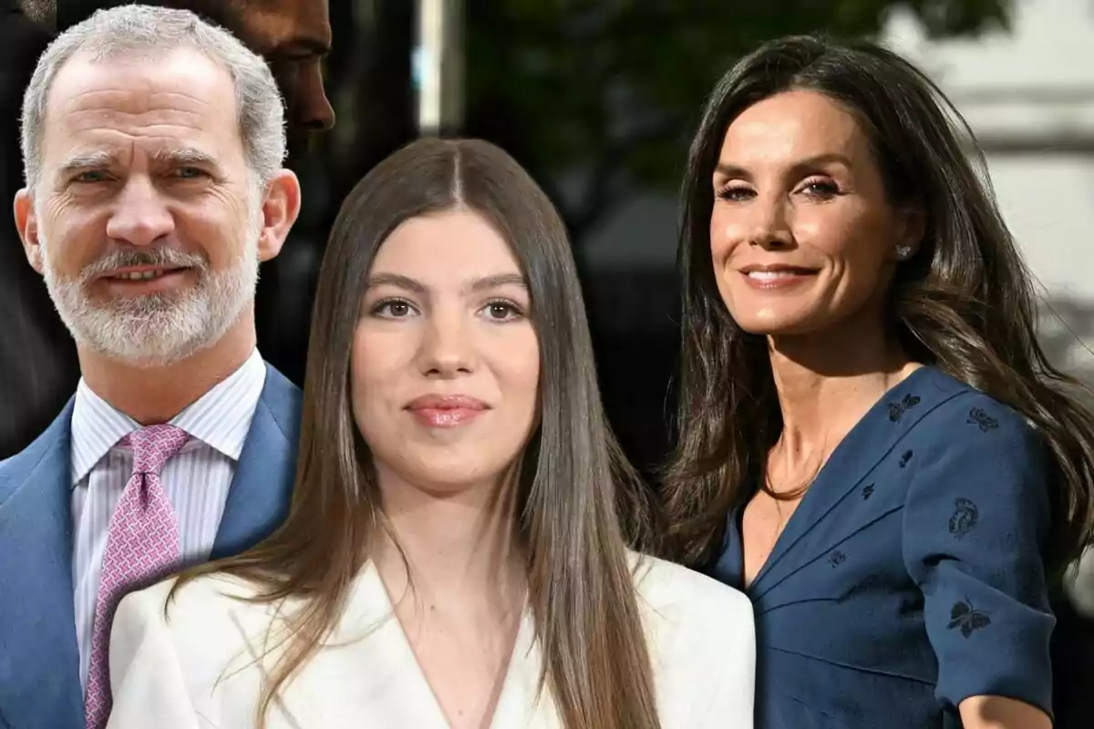 Felipe VI, la infanta Sofía y la reina Letizia posan sonrientes al aire libre, un hombre de barba canosa con traje azul, una joven de cabello largo y liso con chaqueta blanca y una mujer de cabello castaño oscuro con vestido azul