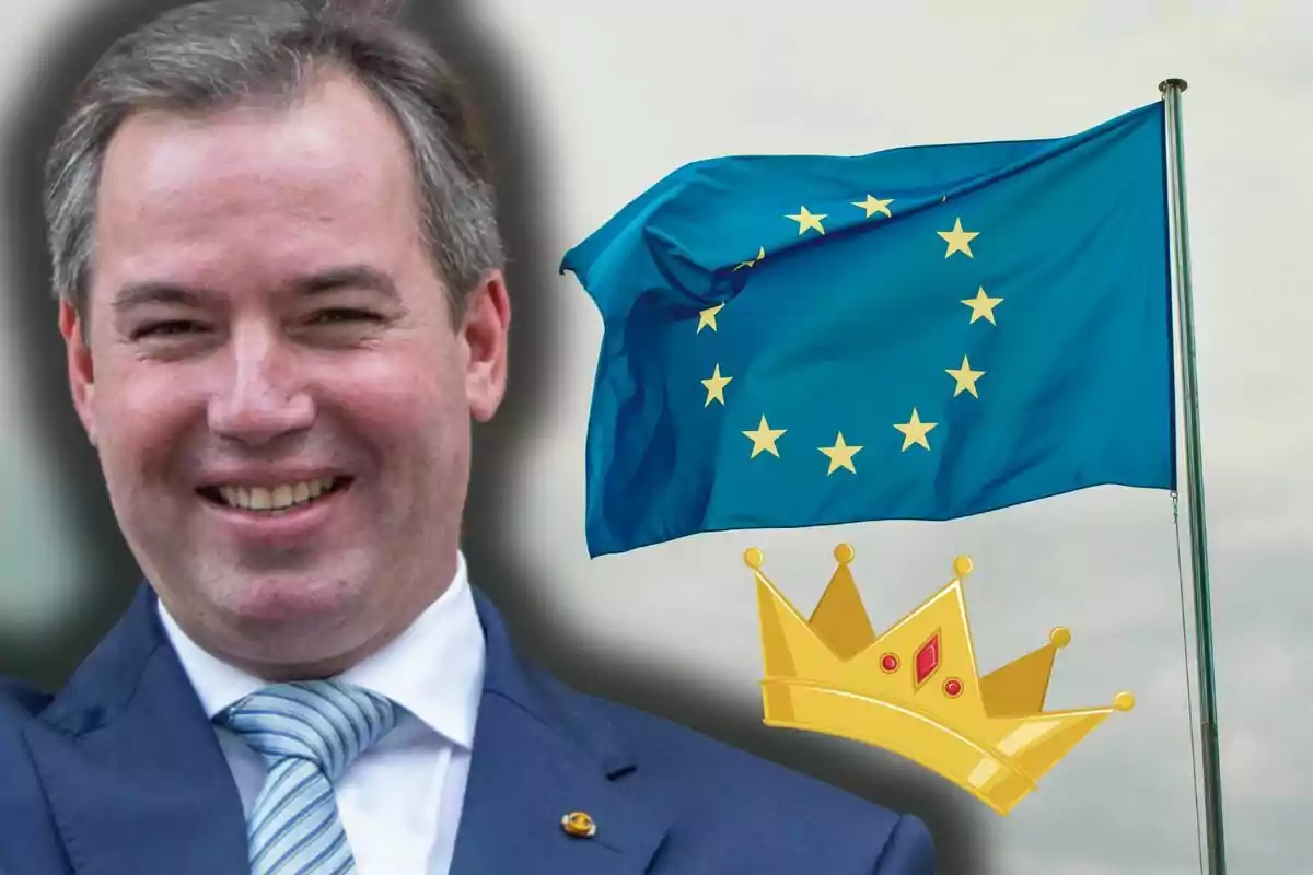 Guillaume of Luxembourg smiling in a suit in front of a European Union flag and a drawn golden crown