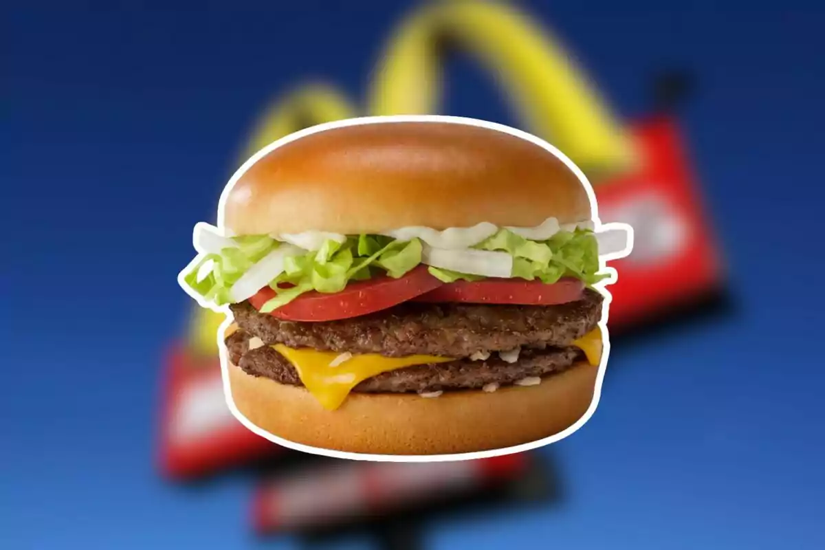 Double cheeseburger with lettuce, tomato, onion, and mayonnaise on a blurred blue background Double cheeseburger with lettuce, tomato, onion, and mayonnaise on a blurred blue background
