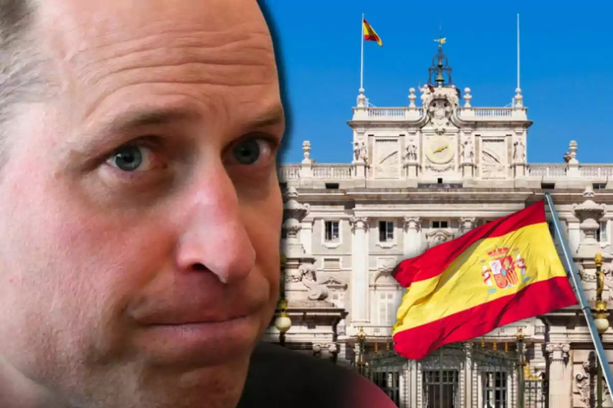 Close-up of Prince William with a serious expression in front of a historic building and a waving Spanish flag