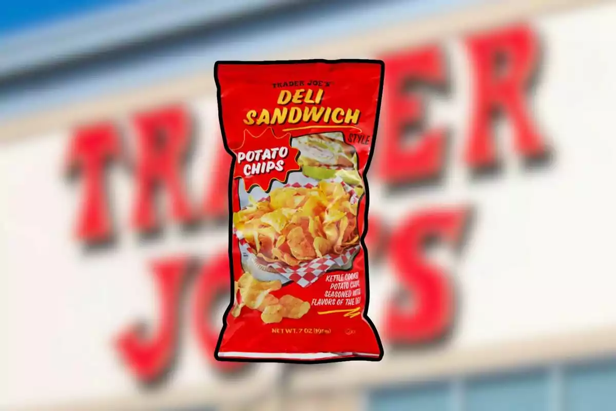 Trader Joe’s deli-style potato chip bag against a blurred background of the store sign. Trader Joe’s deli-style potato chip bag against a blurred background of the store sign.