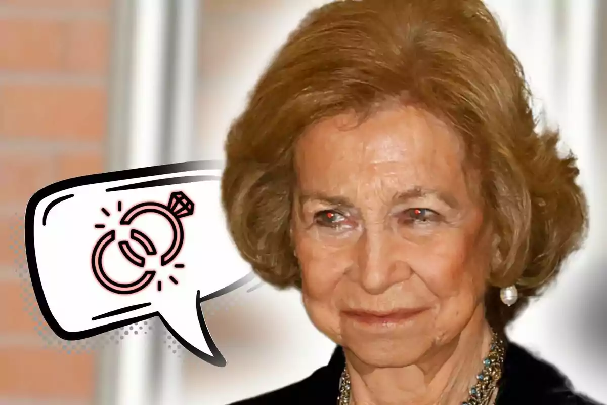 Primer plano de la reina Sofía con expresión seria y un bocadillo de cómic a su lado que contiene el dibujo de un anillo roto.