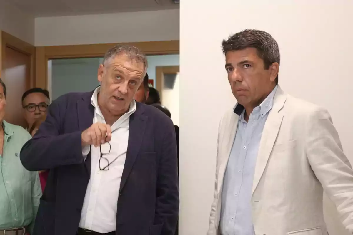 Dos hombres con chaquetas formales están en un interior, uno sostiene unas gafas y parece estar hablando mientras el otro observa con expresión seria. Dos hombres con chaquetas formales están en un interior, uno sostiene unas gafas y parece estar hablando mientras el otro observa con expresión seria.
