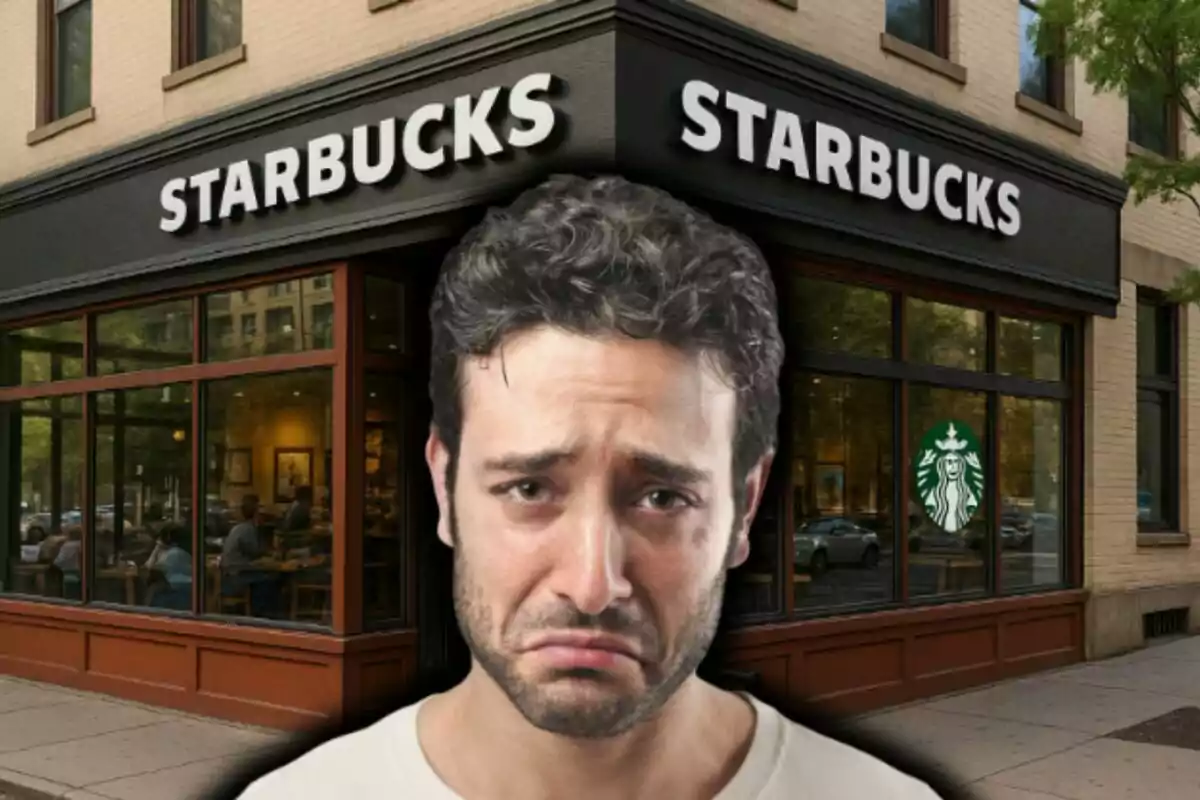 Man with a sad expression in front of a Starbucks café.