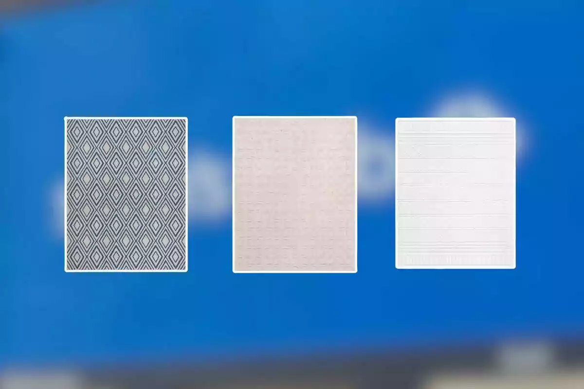 Three rectangular rugs with different patterns and colors on a blurred blue background Three rectangular rugs with different patterns and colors on a blurred blue background