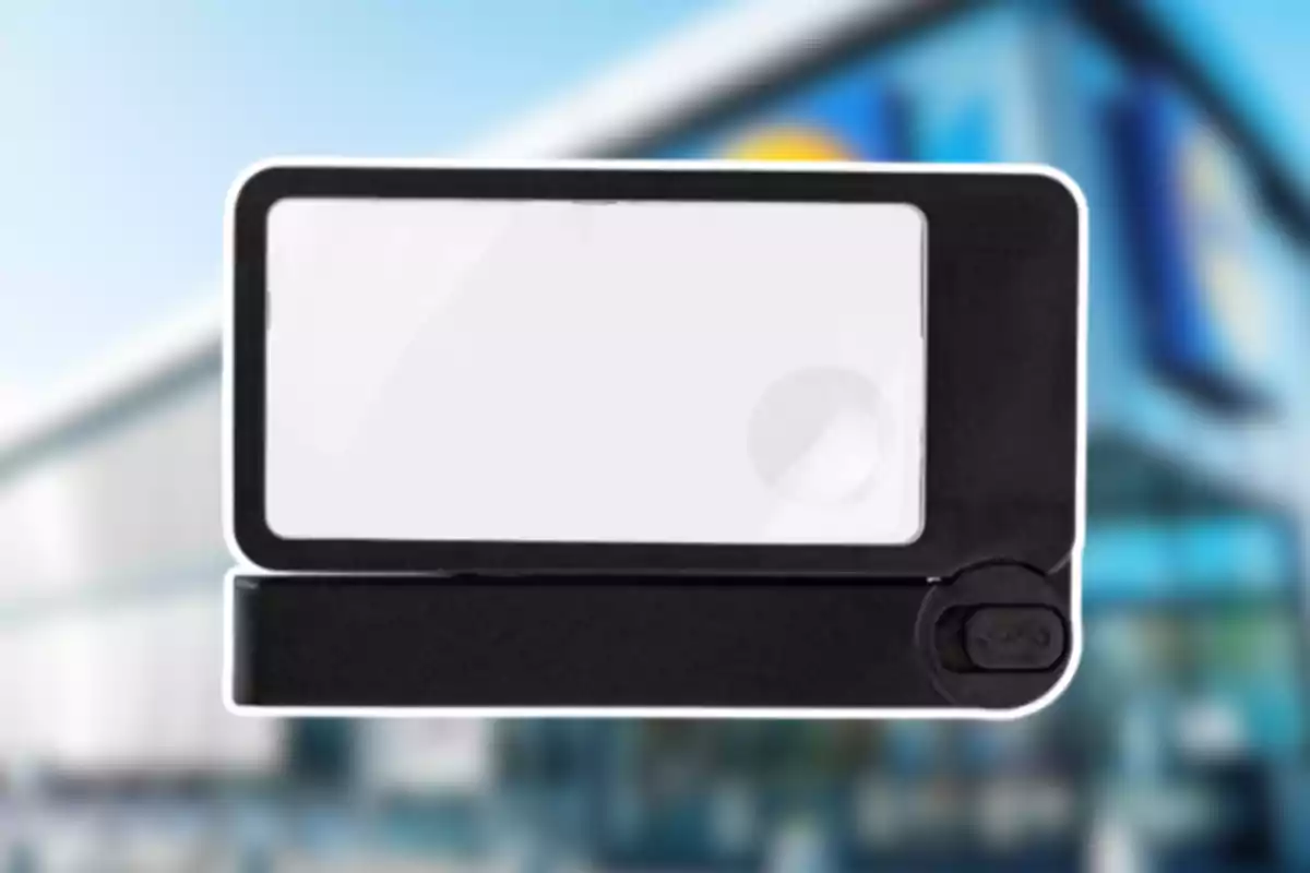 Lupa rectangular de mano con marco negro y fondo borroso de edificio moderno Lupa rectangular de mano con marco negro y fondo borroso de edificio moderno