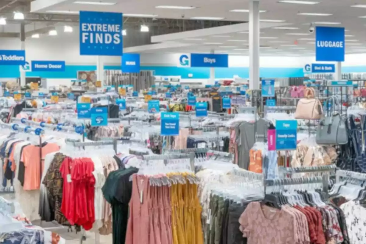 Department store with clothing, bags, and blue signs indicating different sections Department store with clothing, bags, and blue signs indicating different sections