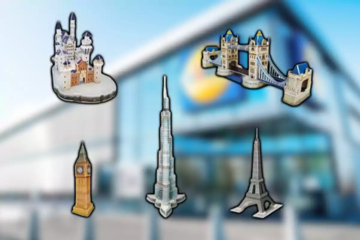Cinco maquetas de monumentos famosos sobre un fondo borroso de un edificio moderno Cinco maquetas de monumentos famosos sobre un fondo borroso de un edificio moderno