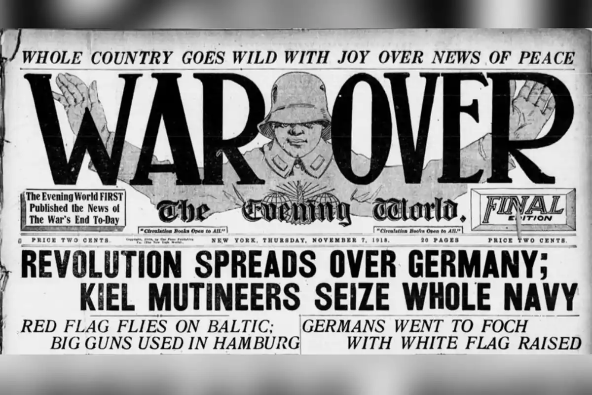 Portada de periódico antiguo anunciando el fin de la guerra con el titular principal "War Over" y noticias sobre la revolución en Alemania y la rendición de la marina alemana
