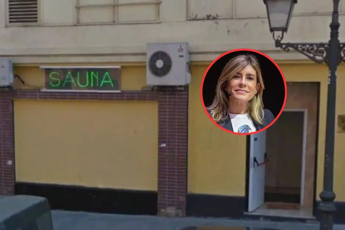 Fachada de un local amarillo con letrero verde de sauna y un recuadro circular que muestra el rostro de una mujer rubia sonriente