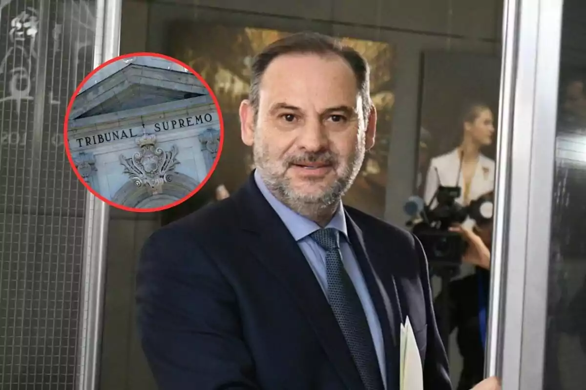 A man in a suit with a beard and short hair holds documents as he walks in front of cameras, with an inset showing the facade of the Supreme Court.