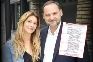 A woman and a man pose together outdoors, with a document framed in red superimposed on the image.