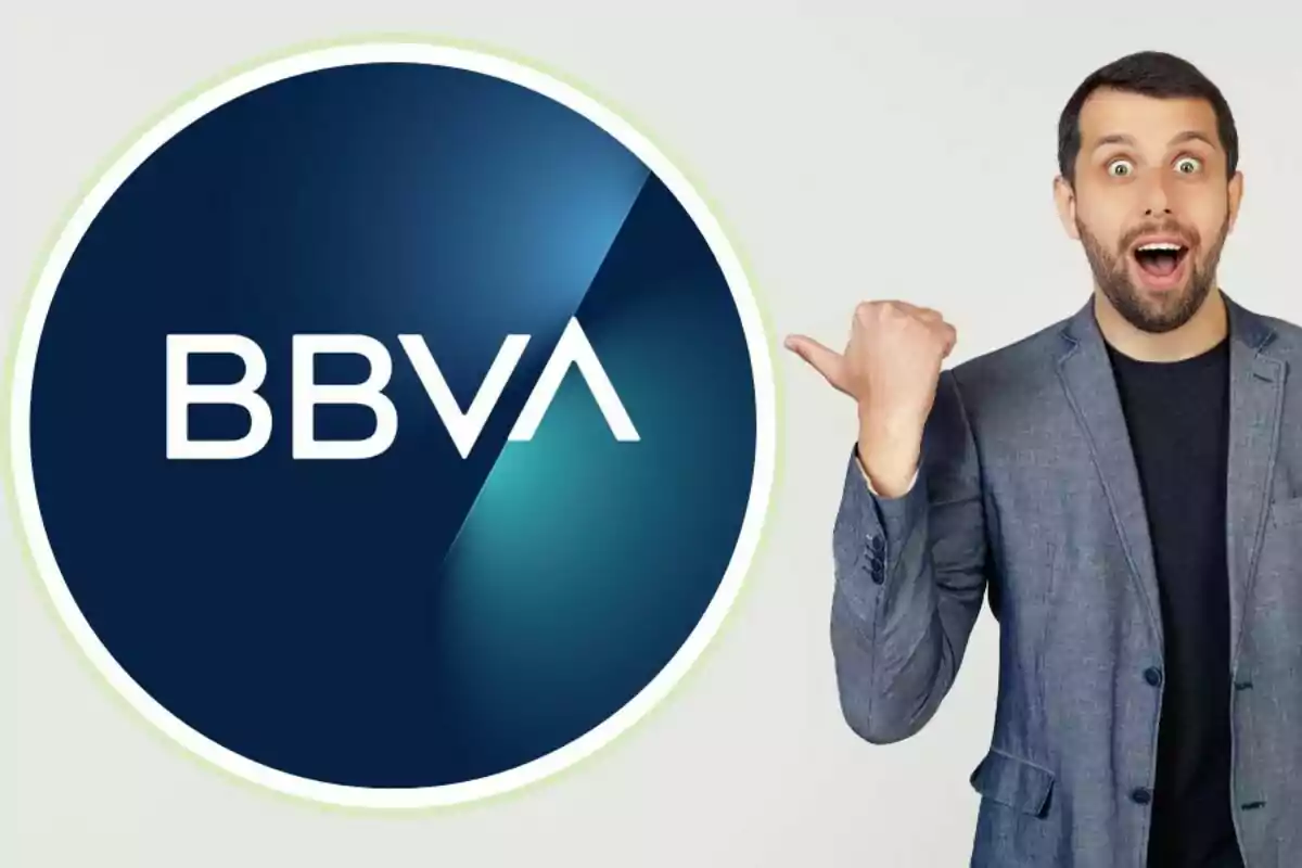 Surprised man pointing at the BBVA logo.