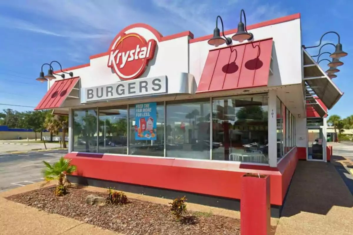 A hamburger restaurant with an exterior design in red and white, with a large sign that says A hamburger restaurant with an exterior design in red and white, with a large sign that says
