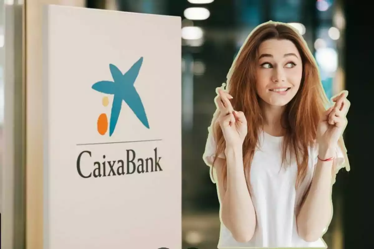 A woman with her fingers crossed in front of a CaixaBank sign.