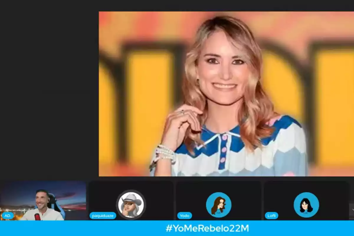 Videollamada con Antonio David Flores con la imagen de Alba Carrillo sonriendo con fondo amarillo y naranja, en la parte inferior aparece la etiqueta YoMeRebelo22M Videollamada con Antonio David Flores con la imagen de Alba Carrillo sonriendo con fondo amarillo y naranja, en la parte inferior aparece la etiqueta YoMeRebelo22M