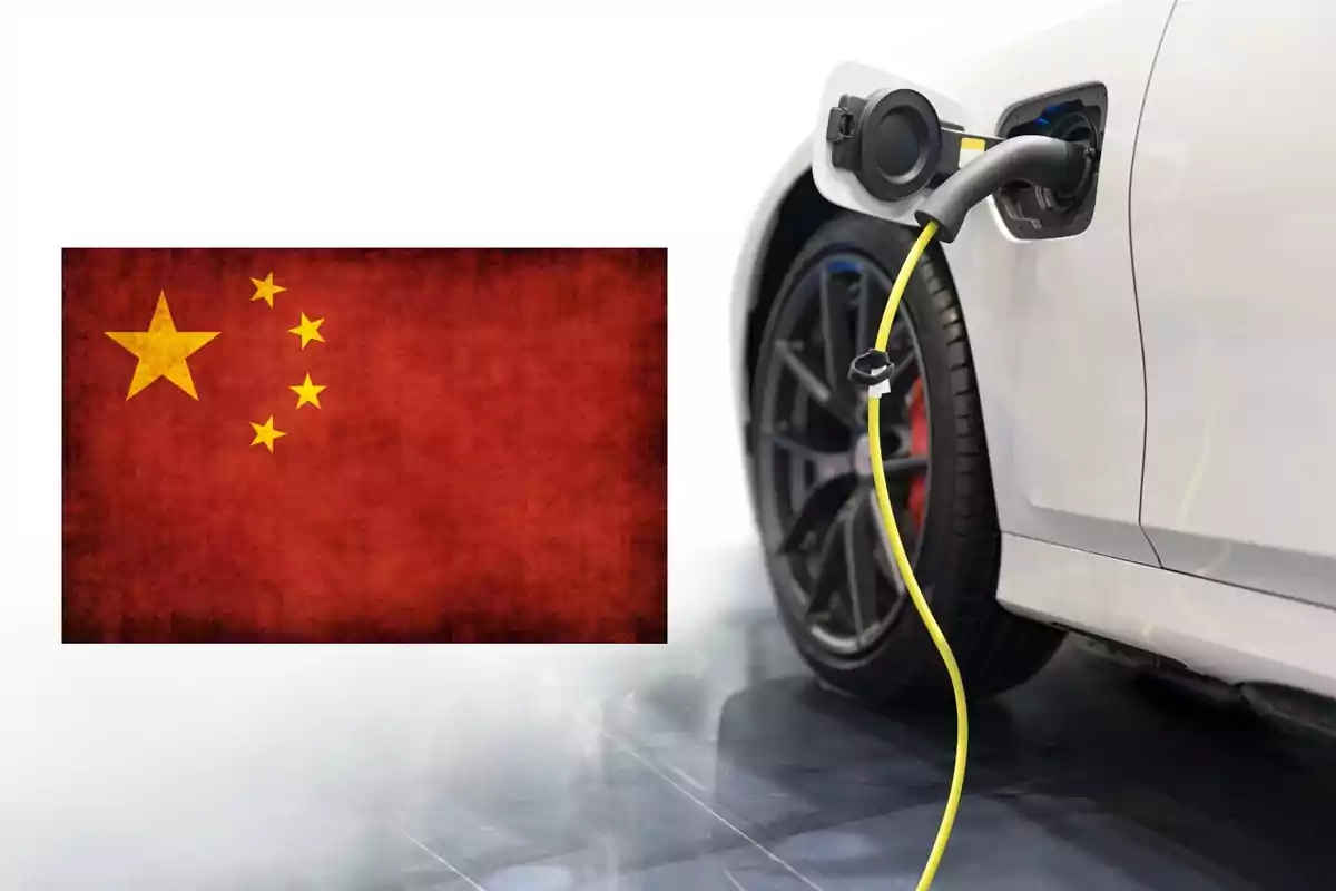 Coche eléctrico blanco cargándose con un cable amarillo junto a una bandera de China.