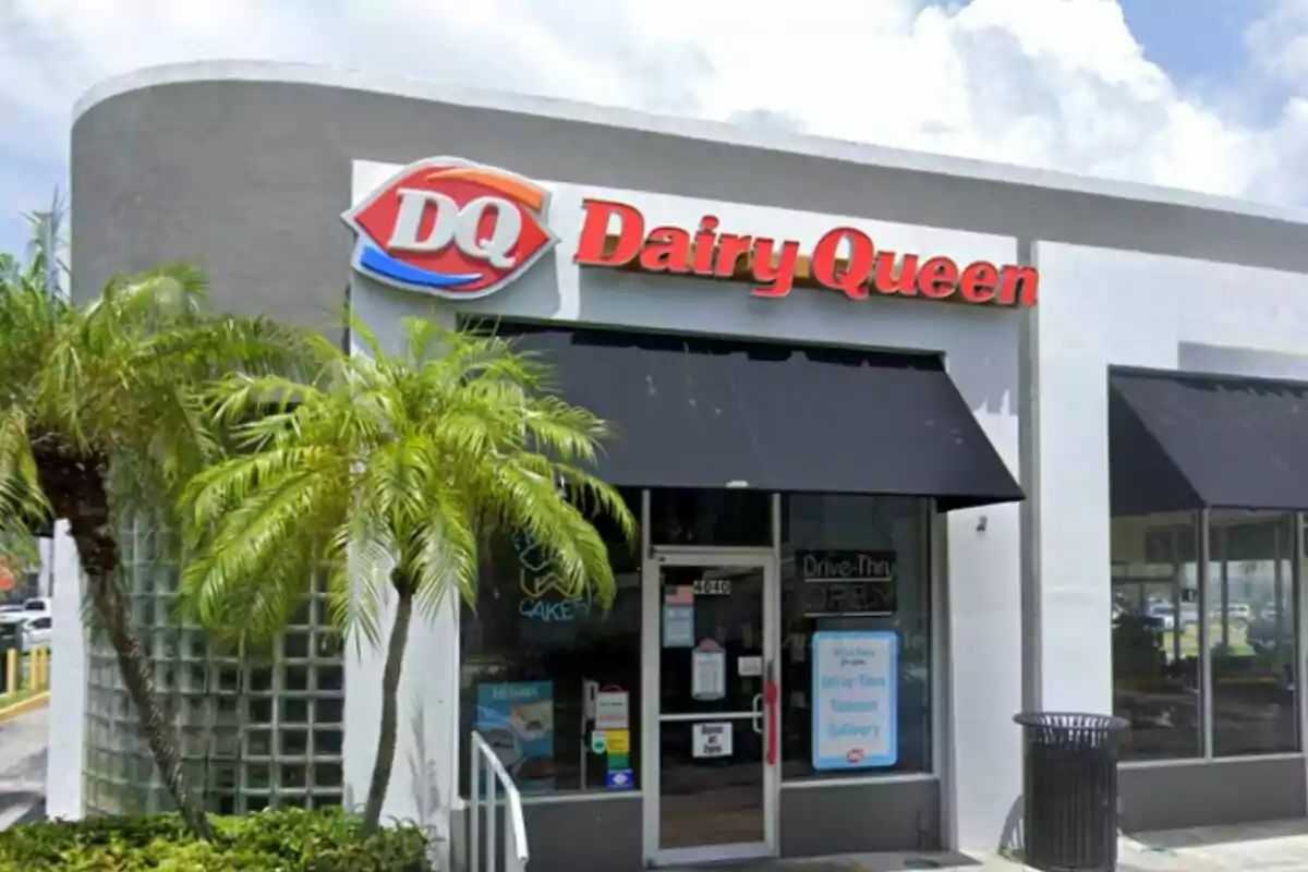 Storefront of an ice cream shop with a sign that says Storefront of an ice cream shop with a sign that says