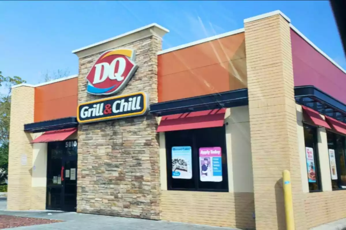 A fast food restaurant with a sign that says A fast food restaurant with a sign that says
