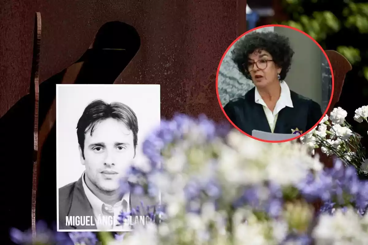 A black and white photograph of a man is placed in front of a monument, surrounded by white and purple flowers, while in the upper right corner there is a box with a woman with curly hair and glasses speaking.