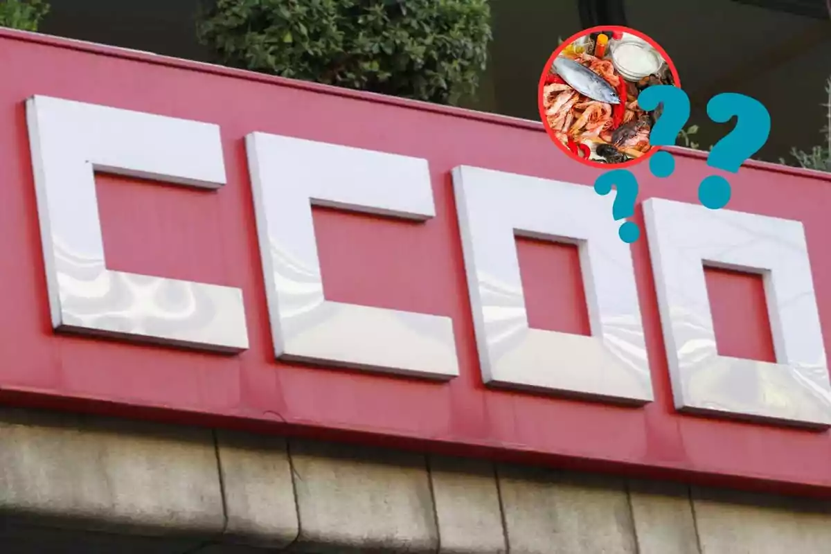 Un letrero rojo con letras blancas grandes que dice "CCOO" y un círculo con una imagen de mariscos y signos de interrogación superpuestos.