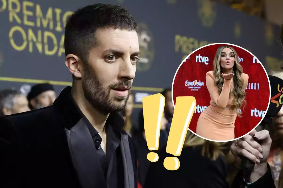 Hombre con barba en un evento de alfombra roja con fondo de letras doradas y un círculo que muestra a una mujer lanzando un beso sobre un fondo rojo junto a dos signos de exclamación amarillos