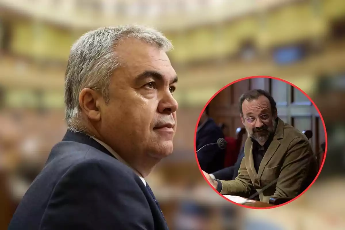 Un hombre de cabello canoso y traje oscuro en primer plano con una imagen circular insertada que muestra a otro hombre con gafas y chaqueta marrón sentado frente a un micrófono