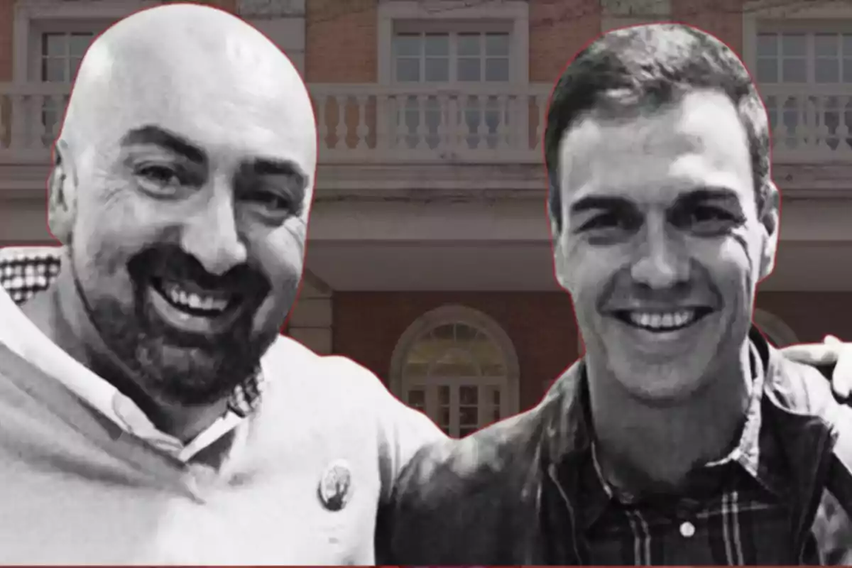 Dos personas sonrientes posan juntas frente a un edificio de ladrillo.