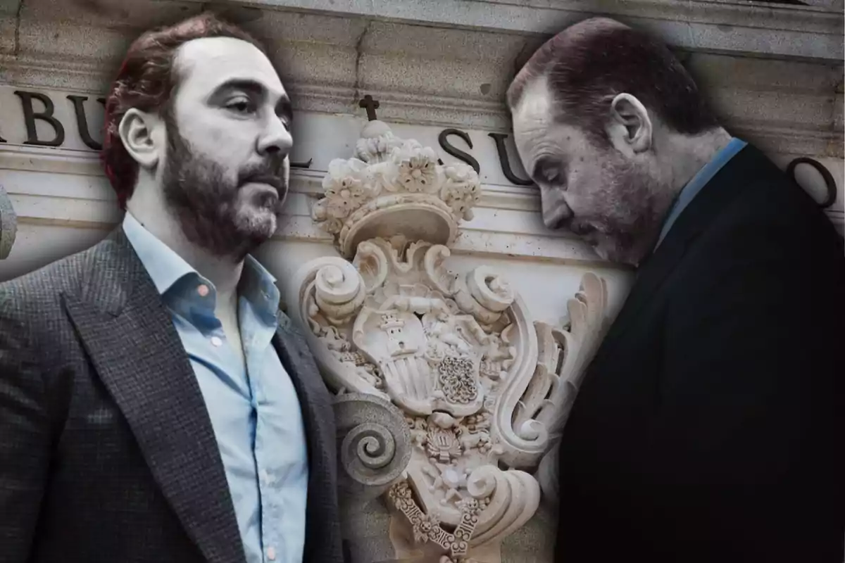 Two men in formal suits in front of a building with a carved stone crest.