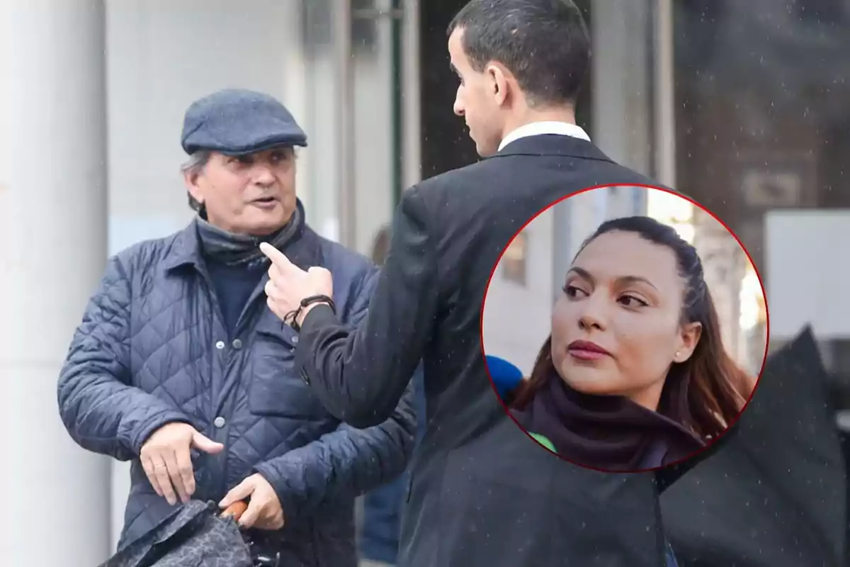 A man in a cap and blue jacket is talking to another man in a suit on the street while a circular image of a woman appears superimposed in the upper right corner.