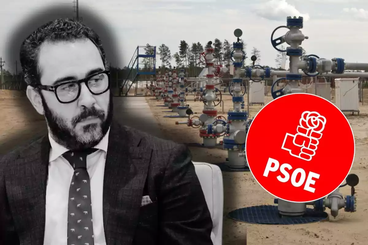 Un hombre con gafas y traje aparece en primer plano mientras al fondo se observa una instalación industrial con tuberías y un logotipo rojo del PSOE.