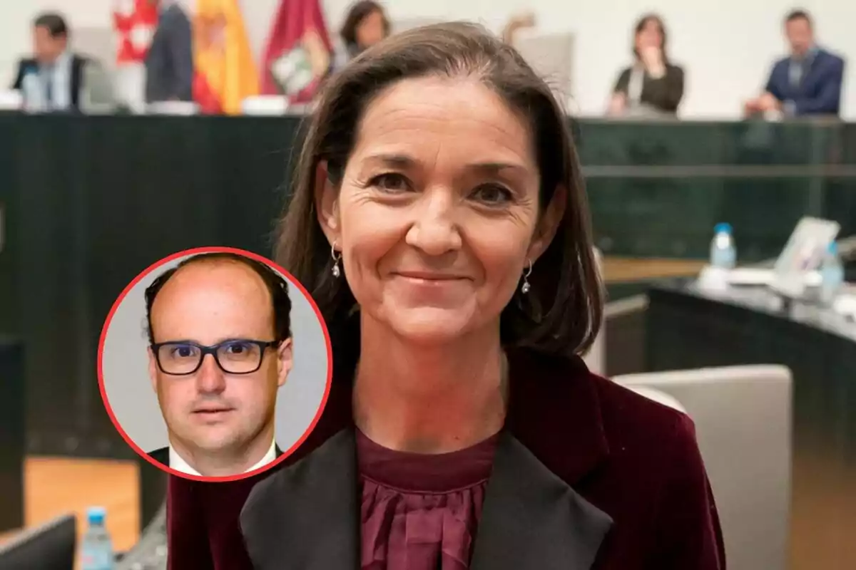 A woman smiles at the camera in an office or meeting setting, with a circular image of a man wearing glasses superimposed in the lower left corner.