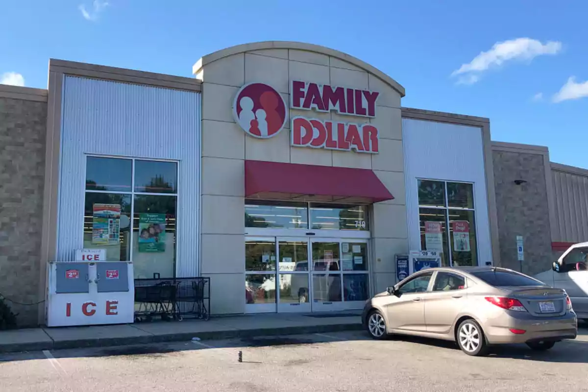 Family Dollar store facade with a car parked in front and an ice machine on the side. Family Dollar store facade with a car parked in front and an ice machine on the side.