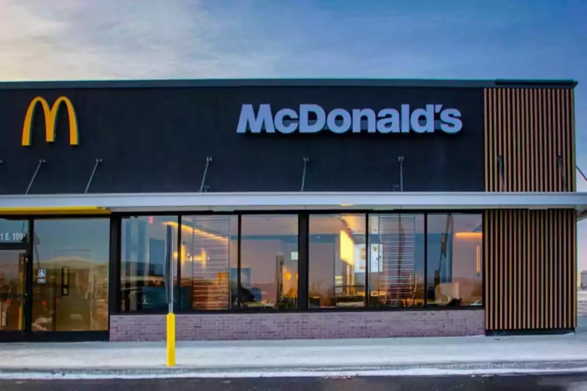 Facade of a fast food restaurant with the McDonald's logo. Facade of a fast food restaurant with the McDonald's logo.