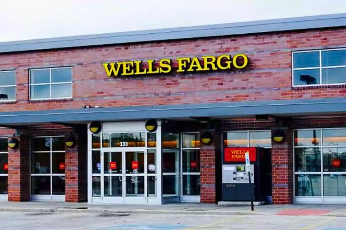 Brick building with a yellow bank sign and an ATM at the entrance. Brick building with a yellow bank sign and an ATM at the entrance.