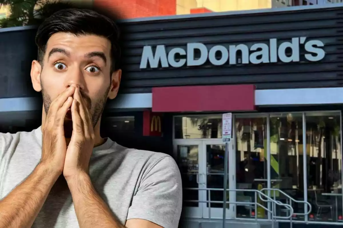 A man with a surprised expression is in front of a McDonald's restaurant.