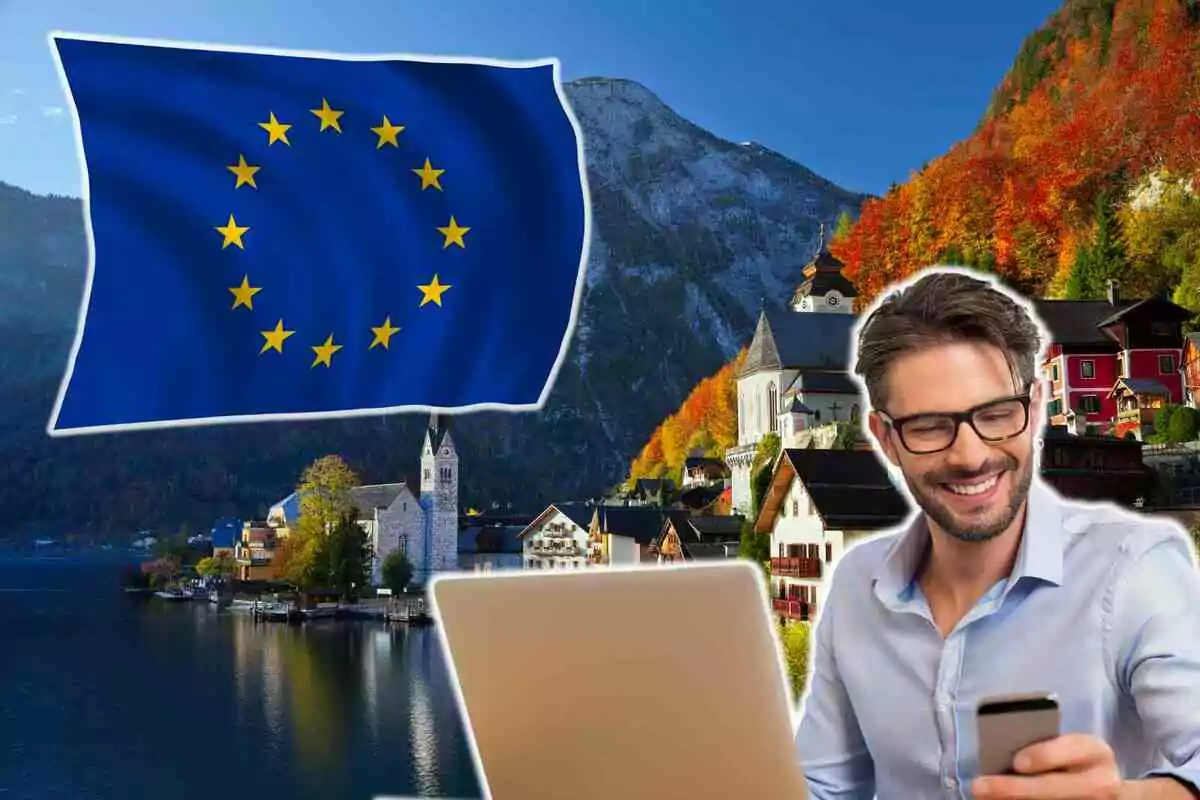 Un hombre sonriente con gafas usa un teléfono móvil y una computadora portátil, con un paisaje europeo de fondo que incluye un lago, montañas y edificios pintorescos, junto a una bandera de la Unión Europea ondeando.