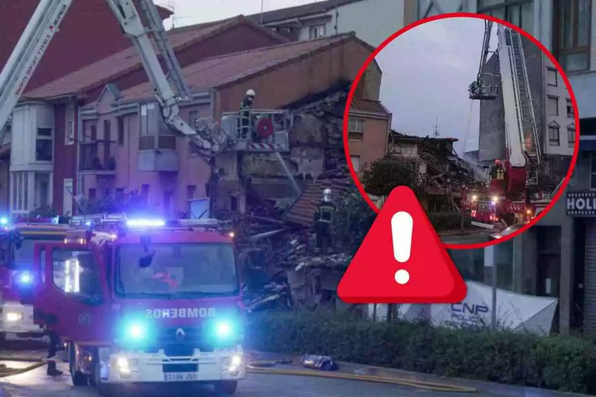 Camiones de bomberos y personal de emergencia trabajando en el lugar de un edificio en Santander parcialmente colapsado.