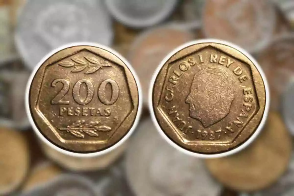 Moneda de 200 pesetas de España con el perfil de un monarca y el año 1987. Moneda de 200 pesetas de España con el perfil de un monarca y el año 1987.
