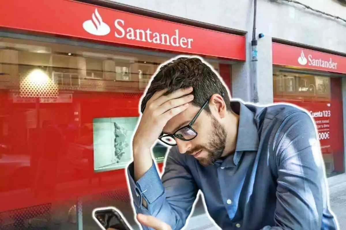 Hombre con expresión preocupada frente a una sucursal del Banco Santander.