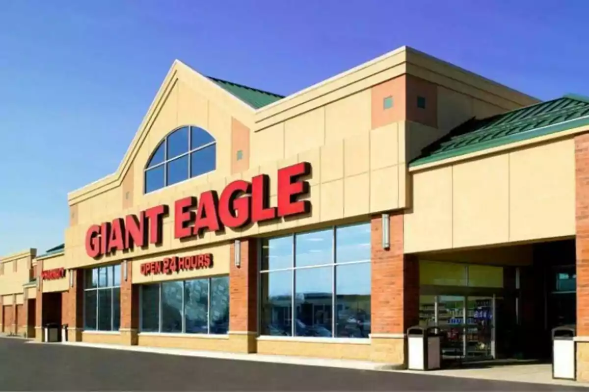 Facade of a supermarket with a large red sign and wide windows. Facade of a supermarket with a large red sign and wide windows.